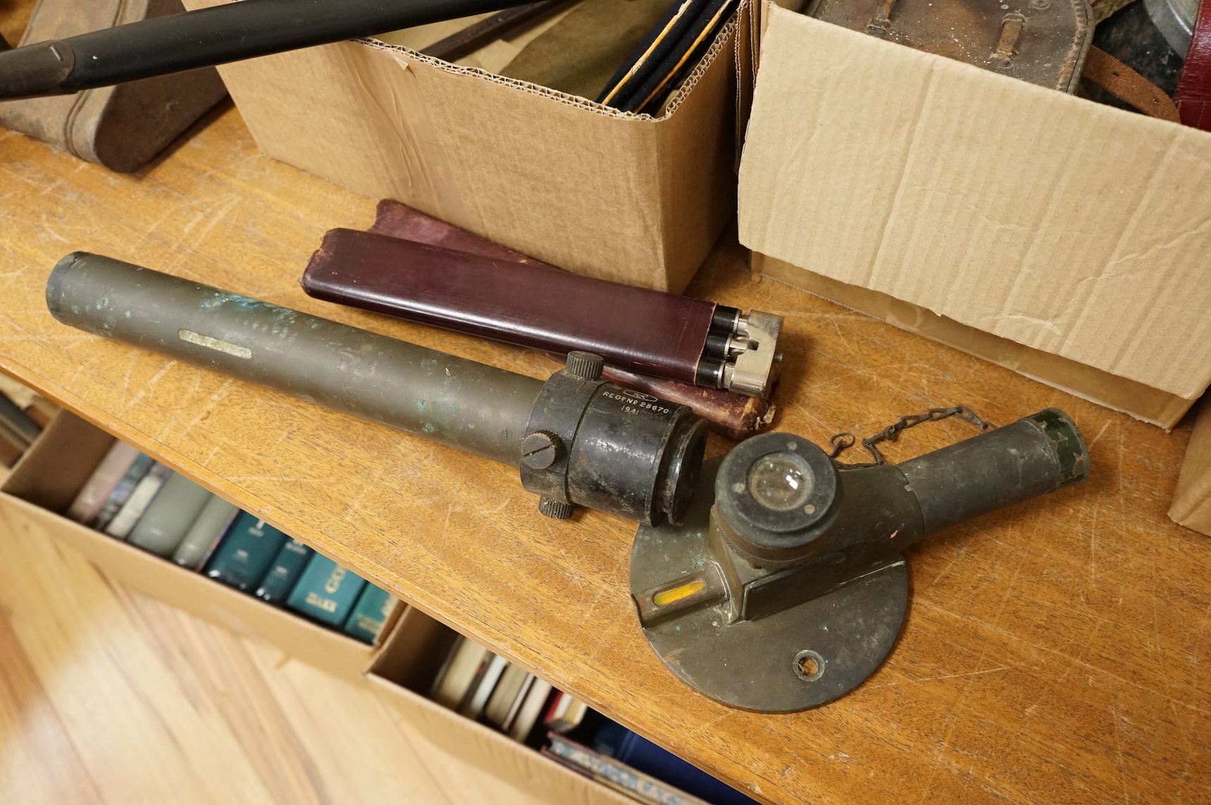 A collection of militaria including; a US Air Force camera Type N-6, a leather cased Bell & Howell Sportster camera and accessories, a pair of periscope binoculars, a leather cased compass by Goerz, Berlin